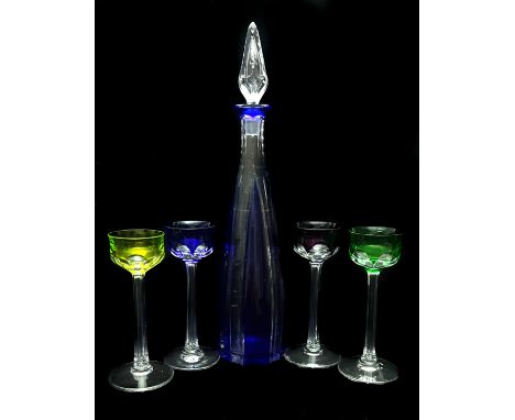 St Louis, France - A cobalt blue overlay glass liqueur decanter cut through to clear; and four harlequin coloured liqueur gla