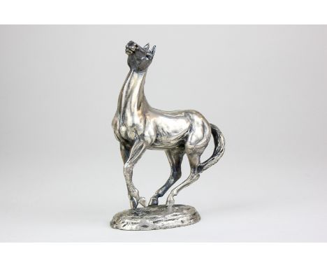 A modern silver statue of a horse, 'Playing Up' by Lorne McKean, 12cm high, hallmarked John Pinces 1975, 19.5oz