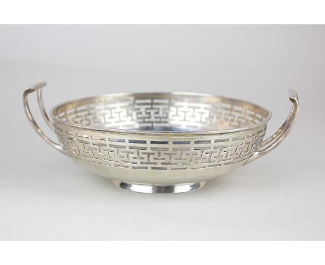 A George V circular silver bowl, maker William Hutton & Sons Ltd, London 1910, with pierced border and two handles, 8.5oz