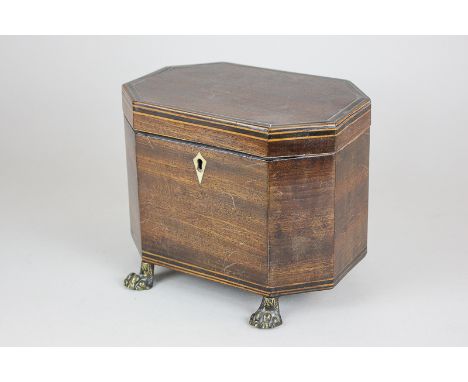 A George III mahogany tea caddy, hexagonal form with banded decoration, on brass paw feet, 18cm