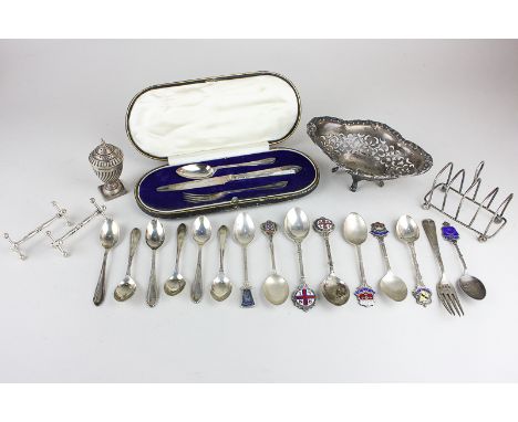 A collection of antique and later silver items, to include a christening set in case, a four slice toast rack, a pepper, a sm