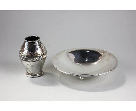 A George V silver bud vase with floral border and hammered pattern, by Albert Edward Jones, Birmingham 1914, and a Continenta