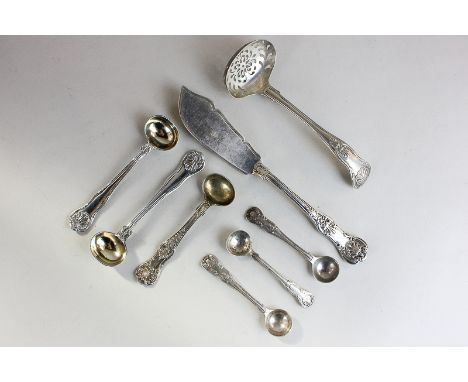 A Victorian silver Kings pattern butter knife, three Kings pattern salt spoons and a sifter ladle, a pair of shell handled mu