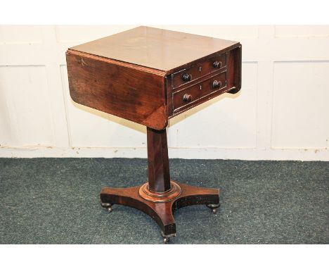 An early 19th century mahogany drop flap side table with two drawers and opposing dummy drawers, on faceted pedestal base, 41