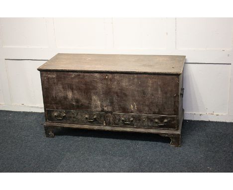 A 19th century stained pine mule chest with side carry handles and two drawers with drop handles, on bracket feet, 108cm