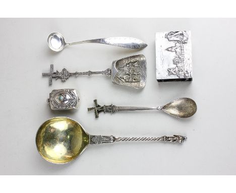 A silver marriage spoon with apostle handle, (probably Dutch 18/19th century), a silver Dutch salt ladle, a Dutch embossed sc