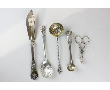 A pair of Victorian sugar nips, maker George W Adams, London 1871, together with a Kings pattern silver mustard spoon, maker 