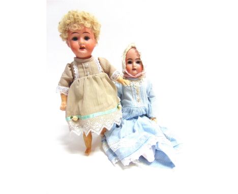 TWO DOLLS  comprising a bisque socket-head doll, with a cropped curly blonde wig, sleeping grey glass eyes, and an open mouth