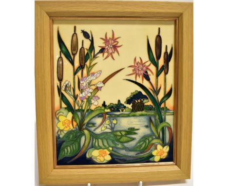 A MOORCROFT POTTERY PLAQUE DECORATED IN THE 'RUNNYMEADE' PATTERN in light oak frame, signed by Nicola Slaney and dated 2015 t