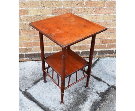 A VICTORIAN WALNUT AESTHETIC MOVEMENT WALNUT OCCASIONAL TABLE  in the manner of E W Godwin, the square section top on turned 