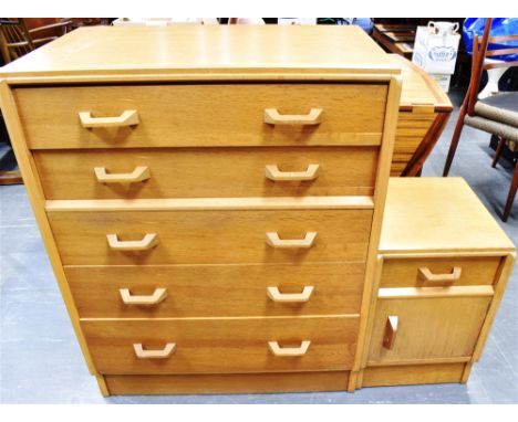 A LIGHT OAK G-PLAN 'BRANDON' CHEST OF FIVE DRAWERS  77cm wide 46cm deep 97cm high; together with a matching bedside cabinet, 