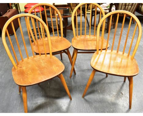 A SET OF FOUR LIGHT ERCOL BEECH AND ELM STICKBACK WINDSOR CHAIRS