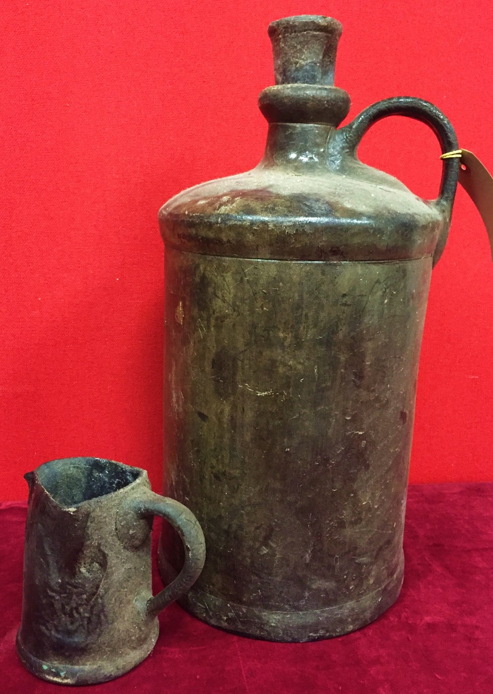 Early leather flagon and jug