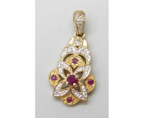 A 9ct gold, diamond and ruby pendant, 2.3g, 2.5cm