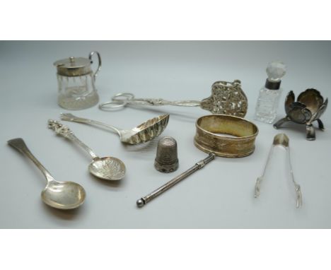 A collection of silver and white metal - a silver swizzle stick, silver mounted glass, a silver napkin ring, a silver spoon, 