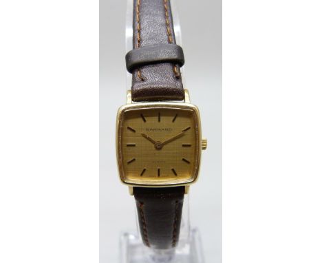 A 9ct gold cased Garrard wristwatch with inscription to case back, 21mm including crown