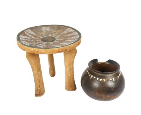 An Ashanti stool with inset beadwork decorated seat, height 29cm, and an African terracotta cooking pot, with mother-of-pearl