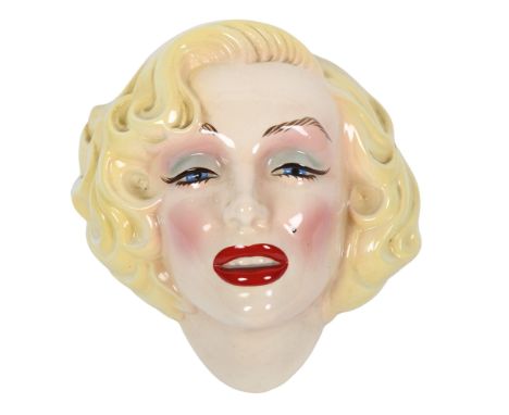 An American Art Pottery painted wall mask of Marilyn Monroe, height 23cm 