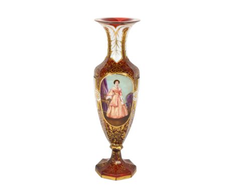 A 19th century Bohemian cranberry glass portrait vase, allover gilded and white enamelled decoration, and female and bird por