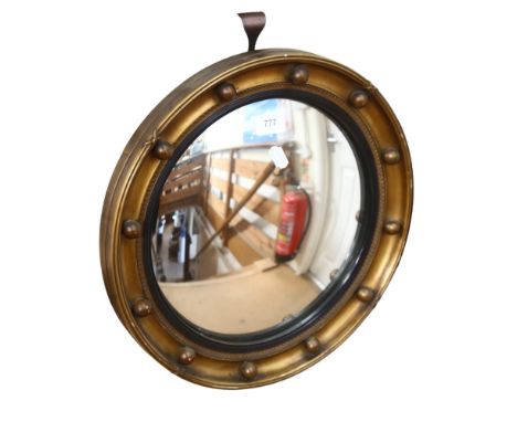 A Vintage convex circular gilt-framed mirror, with ball decoration, 39cm 