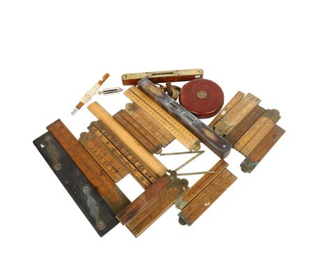 A quantity of Vintage measuring instruments, tape measures, rulers and levels 