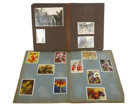 A Vintage family photograph album, and a cigarette card album (2) 