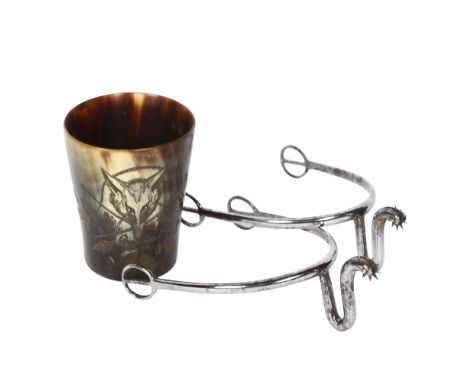 A small horn beaker with engraved fox hunting scene, and a pair of Antique steel spurs 