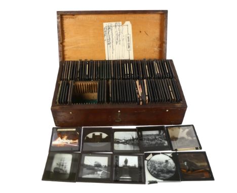 A collection of various interesting magic lantern slides in a case, including some coloured jester style slides, St Paul's Ca