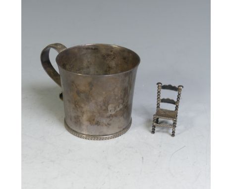 A George VI silver Mug, by Fowler &amp; Polglaze Ltd., hallmarked Sheffield, 1937, of plain circular form with a band of Celt