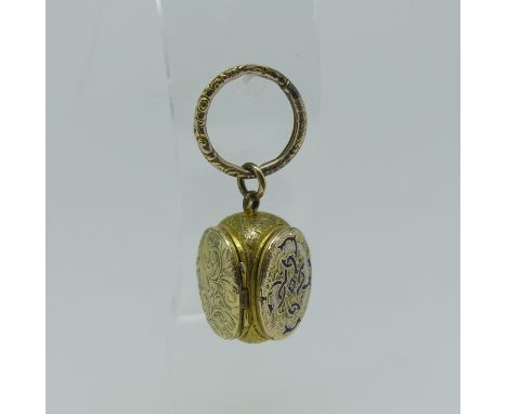 A late 19thC Triple Locket, in yellow metal, two oval hinged sections with blue and white enamel decoration, the other foliat