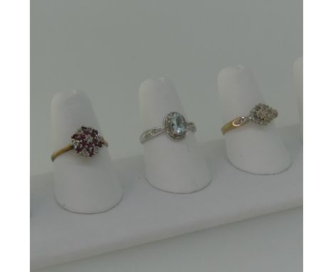 A ruby and diamond cluster Ring, mounted in 9ct gold, Size N, together with a 9ct gold and diamond cluster ring, Size O and a