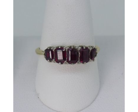 A graduated five stone ruby Ring, mounted in 18ct yellow and white gold,&nbsp;centre and one outer stone chipped, Size P½, ap
