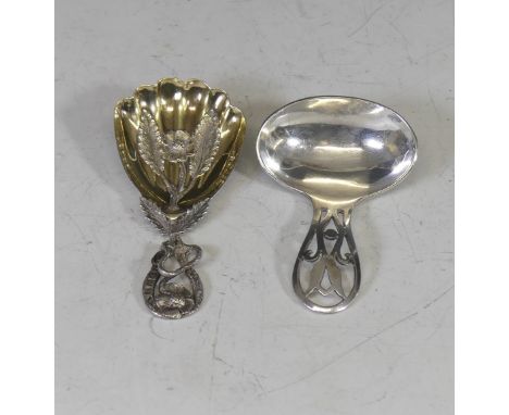 A Victorian silver gilt Caddy Spoon, by&nbsp;Hilliard &amp; Thomason, hallmarked Birmingham, 1852, the gilded shell shaped bo