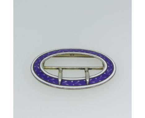 A George V silver and enamel Buckle, by&nbsp;Lawrence Emanuel, hallmarked Birmingham 1910, oval with purple and white enamel,