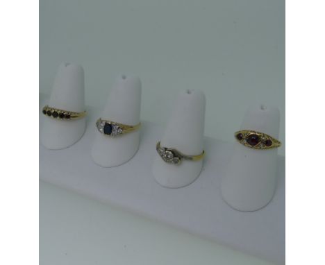 A sapphire and diamond cluster Ring, the central sapphire 4.8mm long, with three diamonds on either side, in a scroll gallery