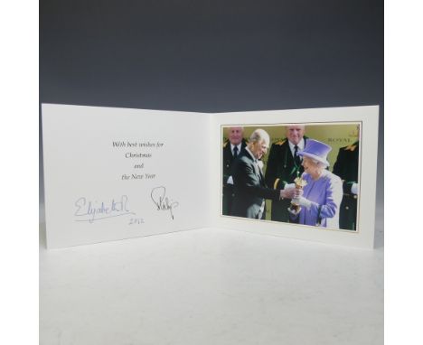 H.M.Queen Elizabeth II and H.R.H.The Duke of Edinburgh, signed 2012 Christmas card with twin gilt ciphers to cover, colour ph