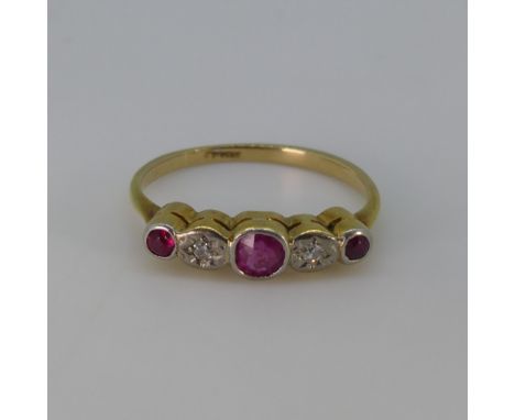 A small ruby and diamond five stone Ring, the central ruby with an illusion set diamond on either side and with a smaller rub