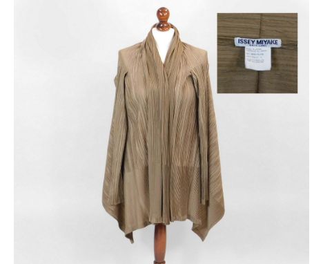 ISSEY MIYAKE.An Issey Miyake pleated polyester jacket with twin-button fastening to create a cowl front. Size 4. Sold with th