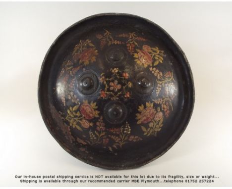INDIAN SHIELD. An Indian hide Dahl, with four decorative bosses &amp; hand painted decoration. The interior with two leather 