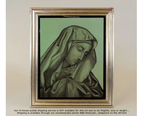 GLASS PANEL. A green glass panel, reversal decorated with the head of a female saint. Modern frame. 26 x 21cm.