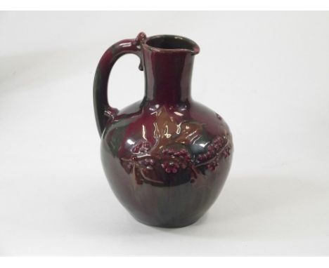 ELTON WARE. An Elton Ware, Sunflower Pottery ewer with floral decoration. Signed. Height 18cm.