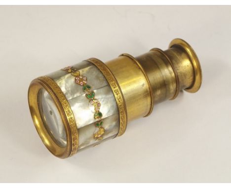 MONOCULAR.A brass & gilt metal monocular, veneered in mother of pearl & with applied enamel decoration. Fully drawn, 7.5cm.