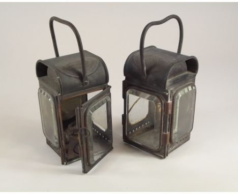 FIRE ENGINE LAMPS. A pair of copper &amp; brass Merryweather fire engine side lamps. One lacking burner &amp; with cracked si