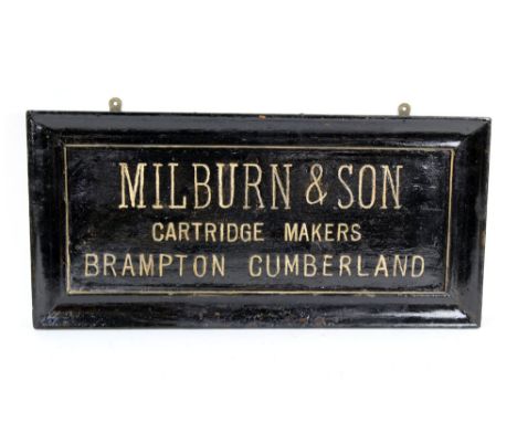 A vintage Millburn &amp; Son Cartridge Makers Brampton, Cumberland sign, later painted in black and gold, 31 x 64 cm.