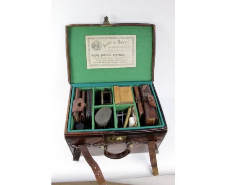 A leather fishing carry all compendium case with fitted interior, with trade label to the lid Army &amp; Navy Cooperative Soc