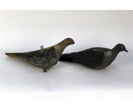 Two antique wooden pigeon decoys, the first made from pine with three piece construction with hanging rings to top and bottom