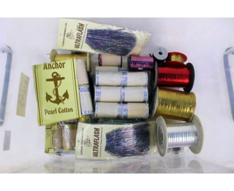 A box of fly tying material, to include anchor pearl cotton, lure flash tinsels etc