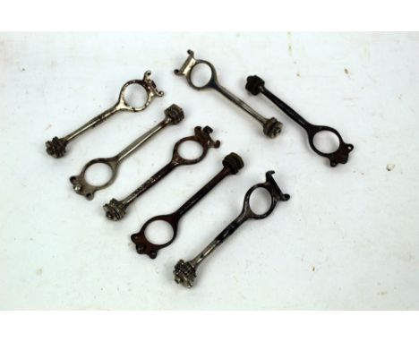 Seven shotgun cartridge extractor tools, to include pin fire versions.