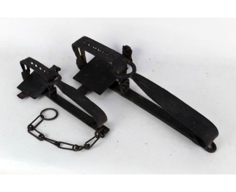 Two vintage gin traps, first large form length 41 cm, second marked C Home length 19 cm excluding chain.