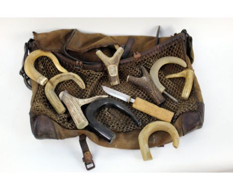 A vintage game bag and a quantity of walking stick handles in horn, antler etc and a partially made fixed blade knife.  THIS 